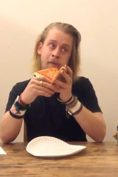 Macaulay Culkin Eating a Slice of Pizza